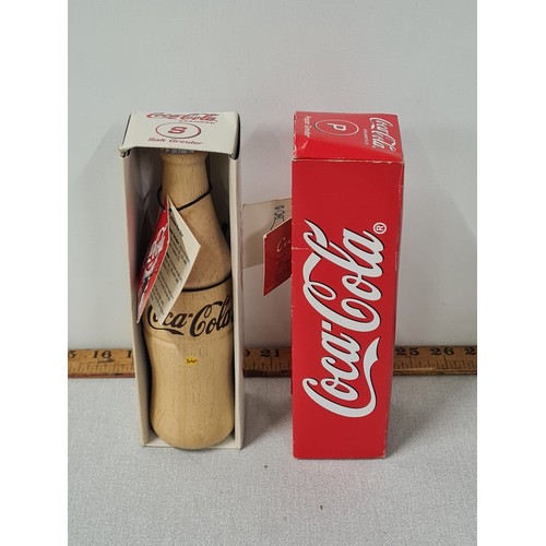 268 - Coca Cola branded wooden salt and pepper grinders.