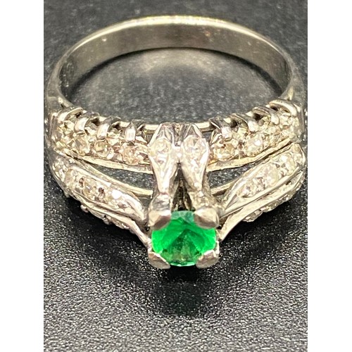 33 - 18ct white gold diamond cluster ring with synthetic emerald. Total 36 diamonds 0.60 carats.