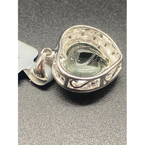 44 - Prasiolite quartz and white topaz sterling silver heart shaped pendant along with silver bracelet.