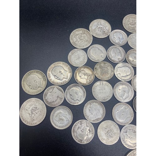 56 - Collection of silver coins to include Victoria and George V Six pence's and shillings.