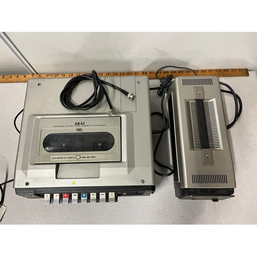 128 - Vintage Akai portable colour VHS player with charger.