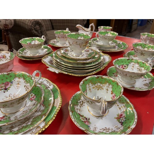 110A - Antique 36 Piece Coalport green 'Batwing pattern' with finely enamelled floral sprays within gilt re... 