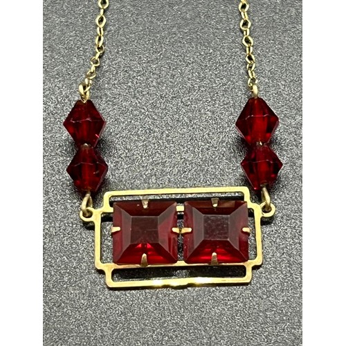 50B - 14ct gold and garnet art deco style necklace.