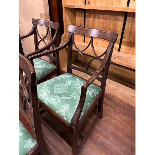 261 - 4 Mahogany upholstered dining chairs to include 2 carvers.