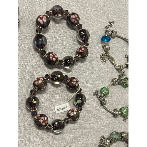 288 - 13 x beaded/charm bracelets.