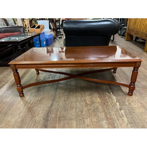 322 - Coffee table with brass detailing.