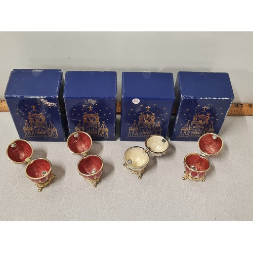 213 - 4 Atlas editions Faberge style decorative eggs with stands.