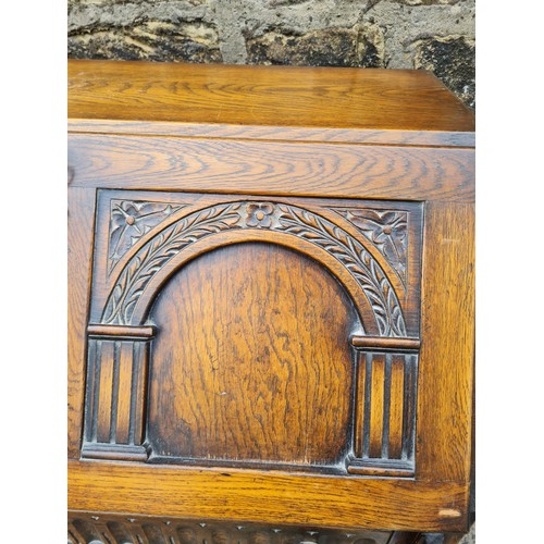 105 - Oak carved writing bureau with key possibly Old Charm. 30