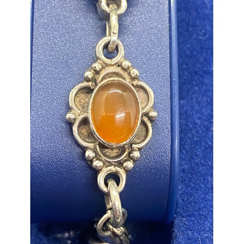 17 - Silver and amber decorative bracelet.