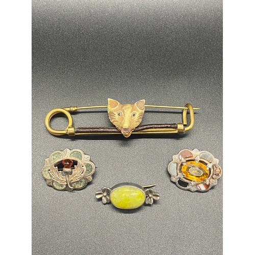 21 - 3 silver Celtic brooches along with vintage fox head hunting/kilt pin/brooch.
