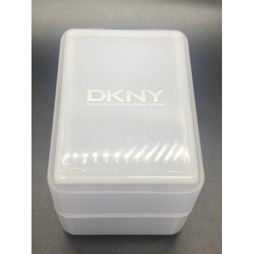 24 - DKNY wrist watch with box, manual and extra links.