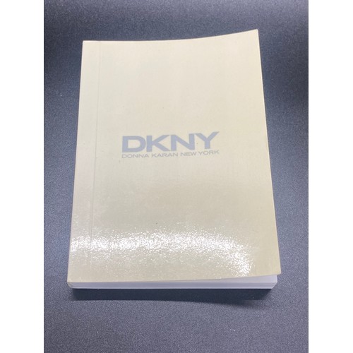 24 - DKNY wrist watch with box, manual and extra links.
