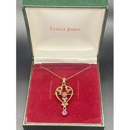25 - Edwardian style Lavalier gem set gold coloured metal necklace.