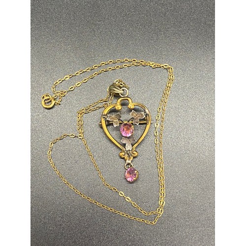 25 - Edwardian style Lavalier gem set gold coloured metal necklace.