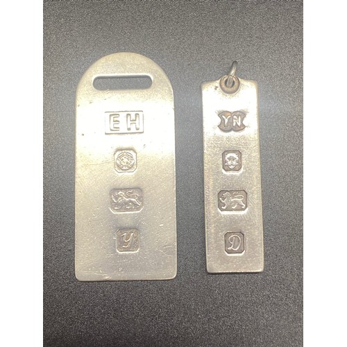 28 - 2 silver ingot pendants 28.6g