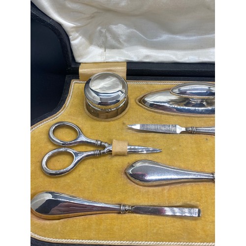 129 - Antique J & Co Hallmarked silver 9 piece manicure set in fitted case circa 1919.