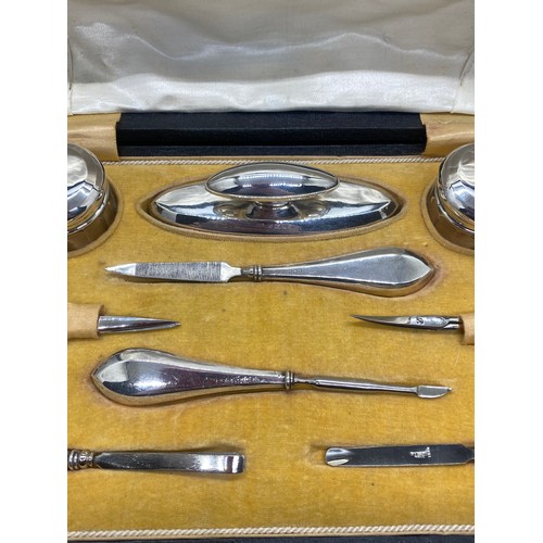 129 - Antique J & Co Hallmarked silver 9 piece manicure set in fitted case circa 1919.