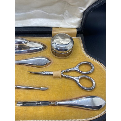 129 - Antique J & Co Hallmarked silver 9 piece manicure set in fitted case circa 1919.