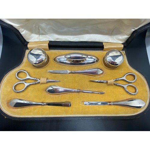 129 - Antique J & Co Hallmarked silver 9 piece manicure set in fitted case circa 1919.