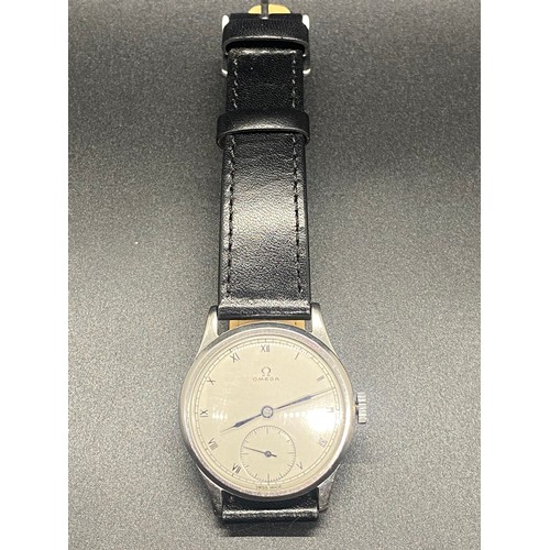 236 - Vintage Omega Swiss made wrist watch with black leather strap. Working.