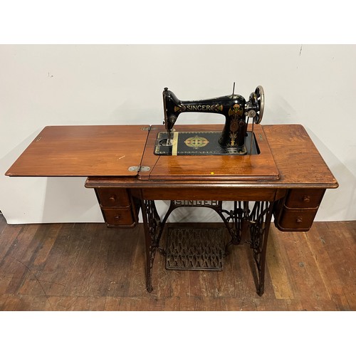 8 - Antique Singer sewing machine & table with 4 drawers, fully integrated with cast iron foot mechanism... 