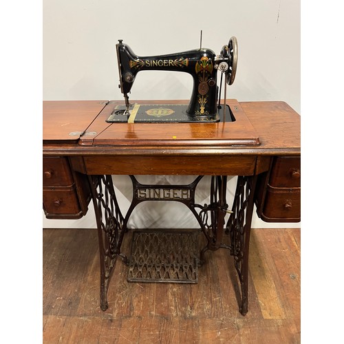 8 - Antique Singer sewing machine & table with 4 drawers, fully integrated with cast iron foot mechanism... 