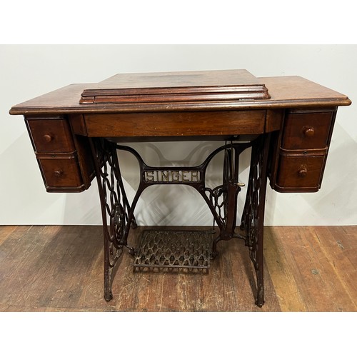 8 - Antique Singer sewing machine & table with 4 drawers, fully integrated with cast iron foot mechanism... 