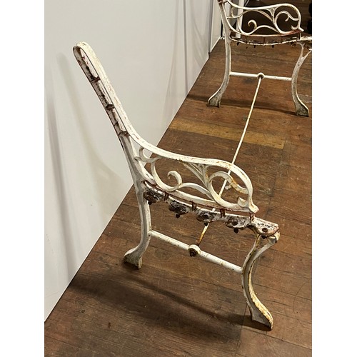 284 - Cast iron bench ends with support bar