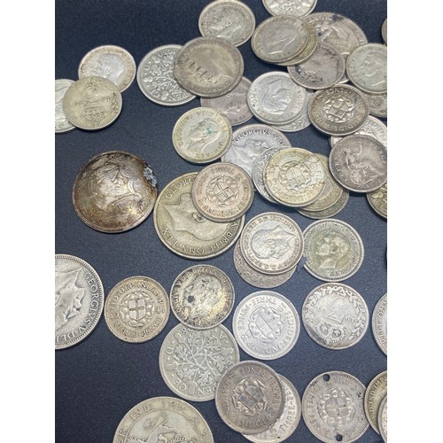 72 - Large collection of silver coins to include 1936 Germany Reichsmark church mark, 1920's florins, Shi... 