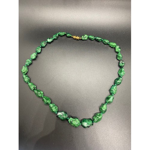 177 - Malachite necklace along with wooden carved black and white necklace.