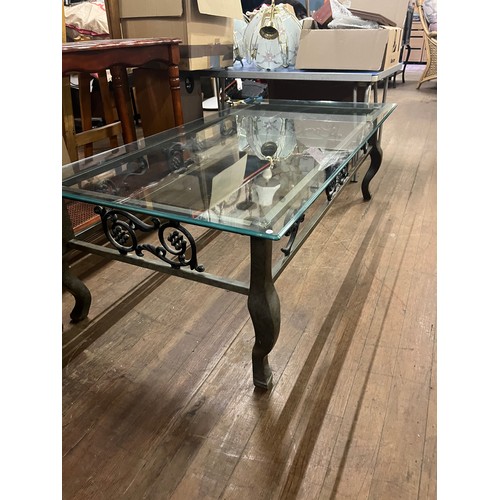 247 - Glass topped coffee table on floral metal base