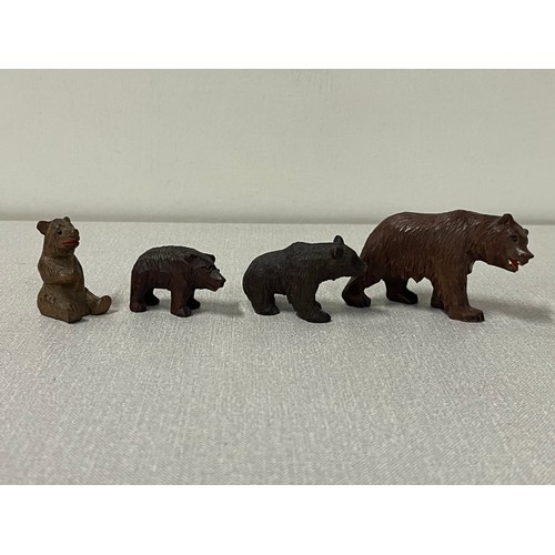 94 - 4 Antique hand carved black forest bears.