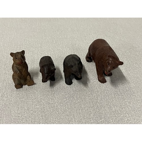 94 - 4 Antique hand carved black forest bears.