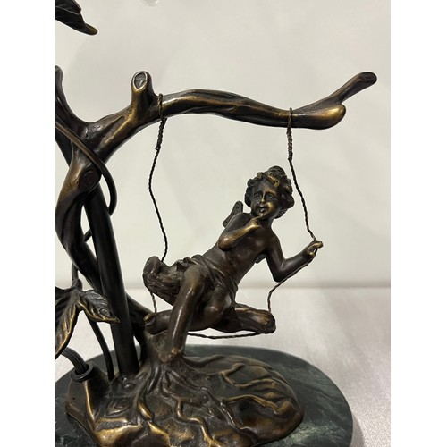 79 - Bronze cherub on swing, lamp with marble base.
15”