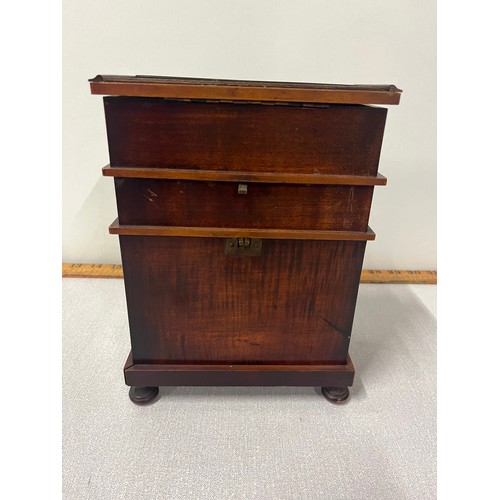 3 - A late 19th century novelty musical smokers cabinet in the form of a harmonium