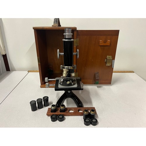 25 - Vintage Beck London microscope with wooden case and 5 lenses and lens holders.