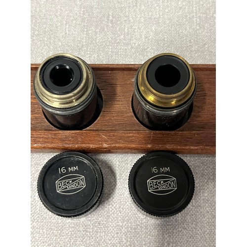 25 - Vintage Beck London microscope with wooden case and 5 lenses and lens holders.