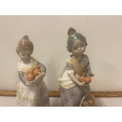 2 - A retired pair of lladro valencian girls with oranges