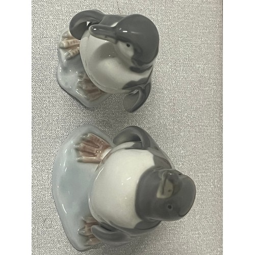 108 - A pair of lladro penguins