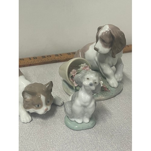 111 - 2 lladro dogs along with cat