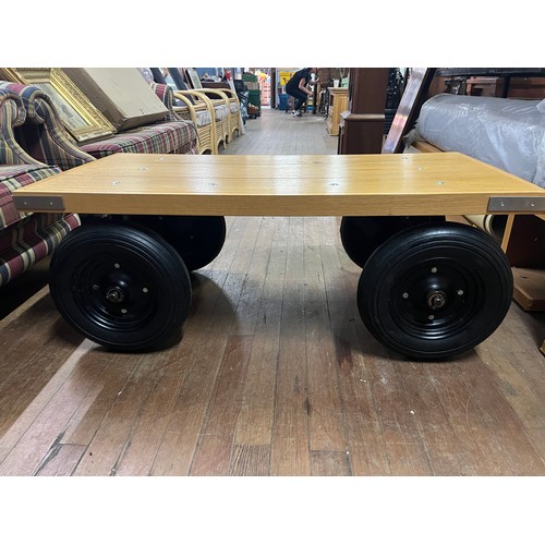 113 - Solid oak coffee table on wheels from shop display (very heavy) 48