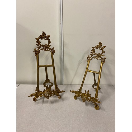 7 - 2 ornate Antique brass display easel's. 
Tallest 20