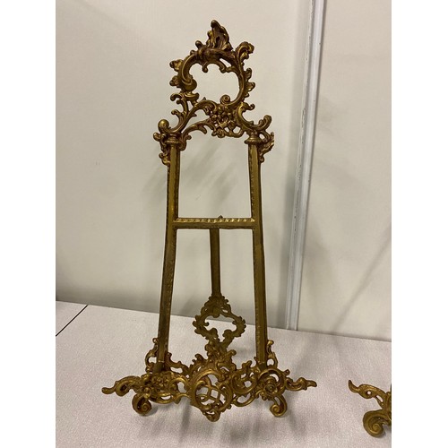 7 - 2 ornate Antique brass display easel's. 
Tallest 20