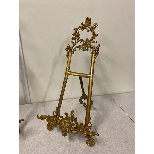 7 - 2 ornate Antique brass display easel's. 
Tallest 20