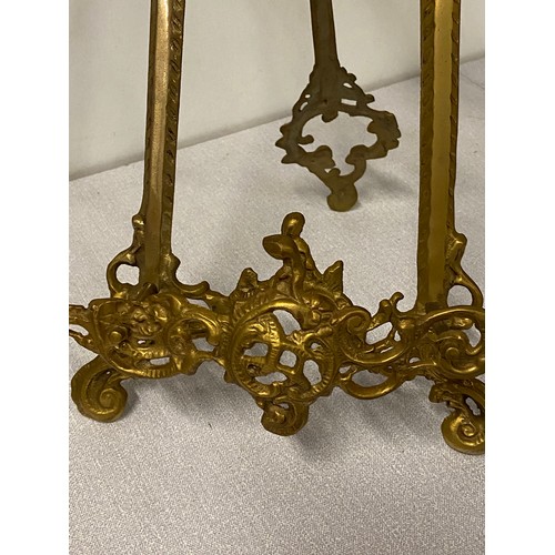 7 - 2 ornate Antique brass display easel's. 
Tallest 20