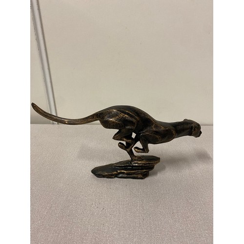 57 - Cast iron running cheetah sculpture. 12