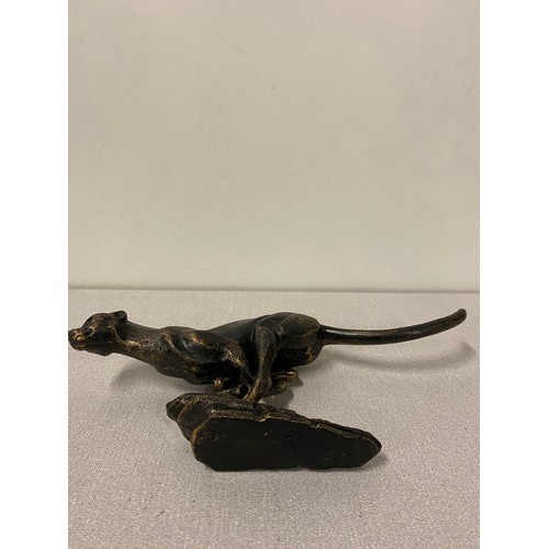 57 - Cast iron running cheetah sculpture. 12