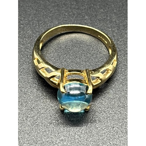 23 - 9ct gold ladies ring with blue topaz 3.3 grams