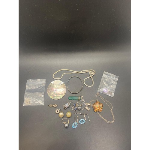 75 - Selection of silver jewellery to include earrings, pendants, necklaces and baby bangle.