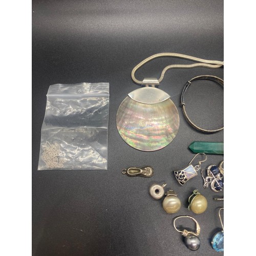 75 - Selection of silver jewellery to include earrings, pendants, necklaces and baby bangle.